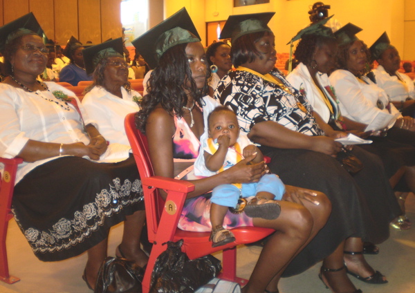 Graduates of Parent University listen to speakers at Sunday ceremony.