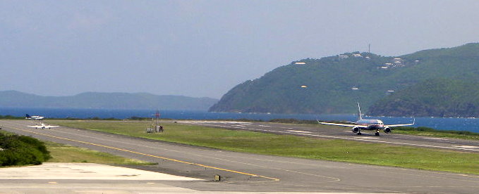 Planes await their turn to take off from Cyril E. King Airport, where the runway has closed three times to deal with loose asphalt during its renovation.