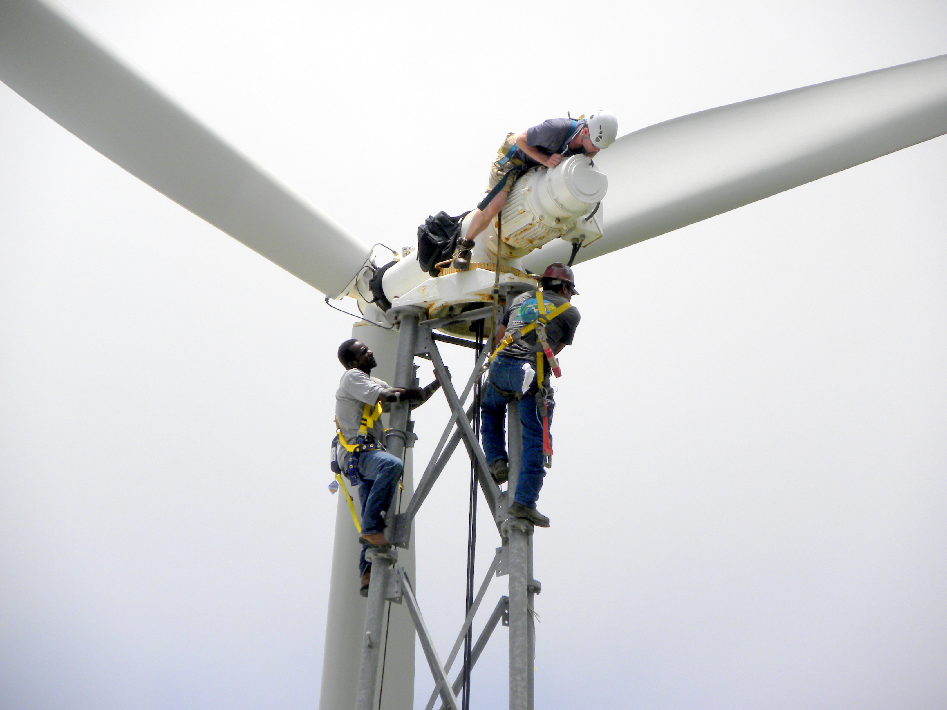 Engineers and technician examine turbine equipment prior to spin-up.