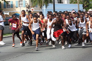 Runners break from the starting line at the annual Walk/Run Against Violence Sunday in Charlotte Amalie.