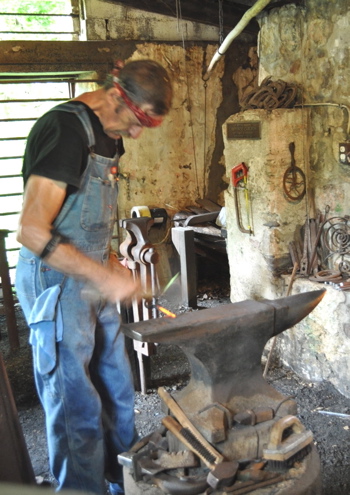 Richard Waugh gives a demonstration in the blacksmith shop.