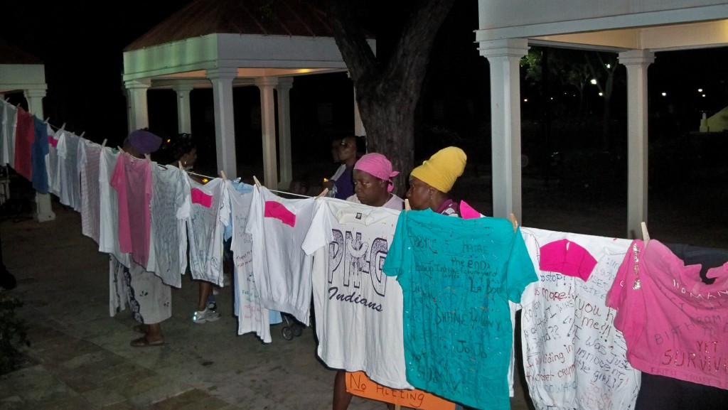 March participants look at the Women's Coalition clothesline.