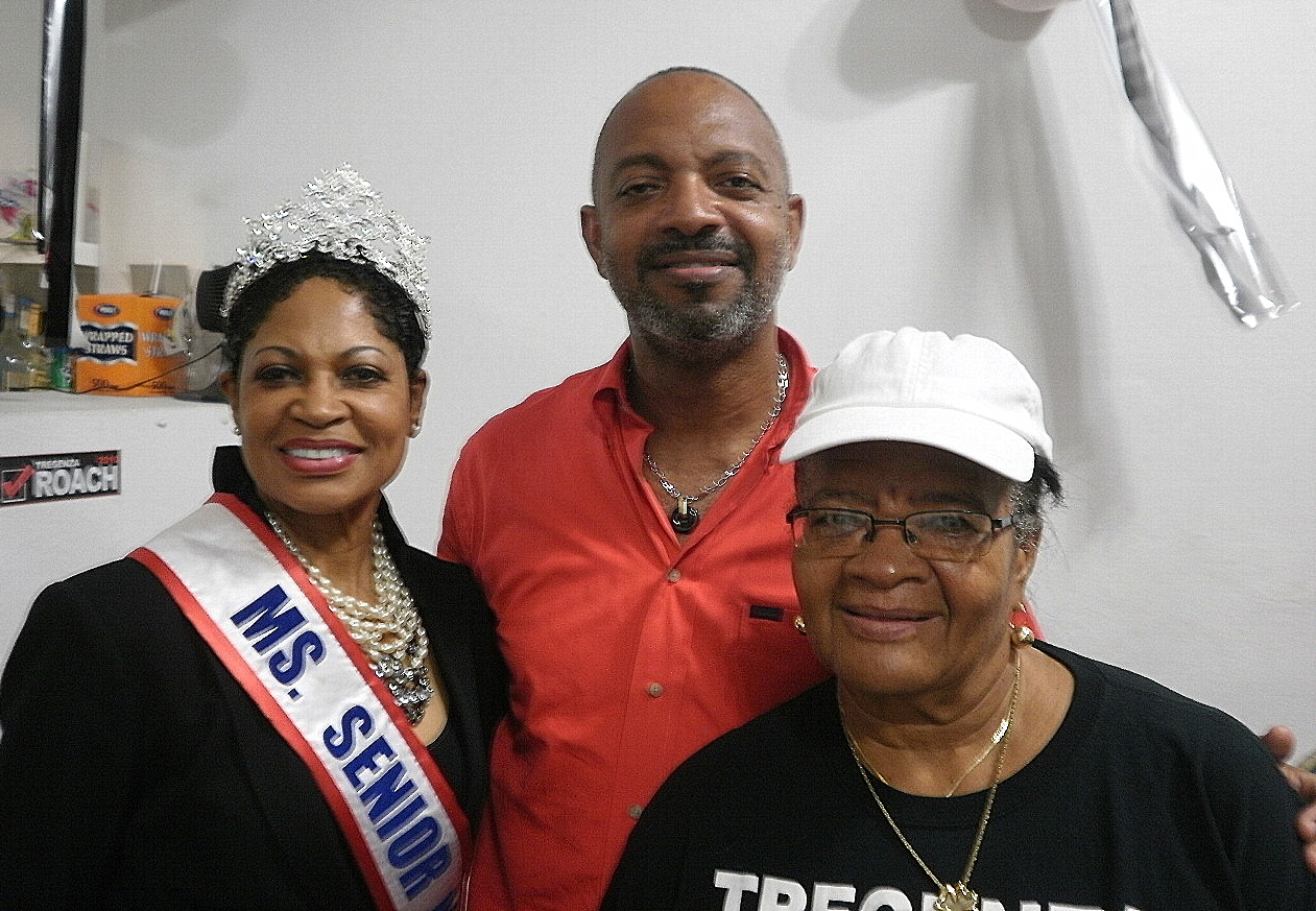 Dr. Kim Moore with Tregenza Roach and his mother, Iona.