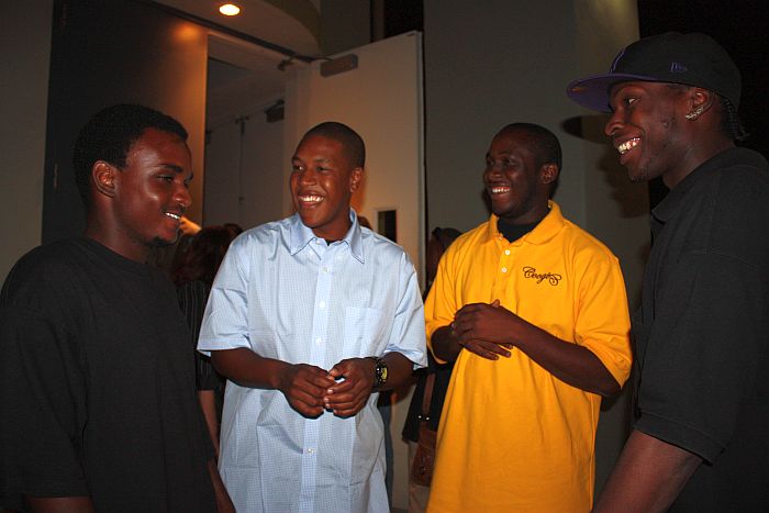 My Brother's Workshop participants Kyle Bussue, Kelvin Xavier, Markim Tonge and Everton Audain share a laugh after the forum.