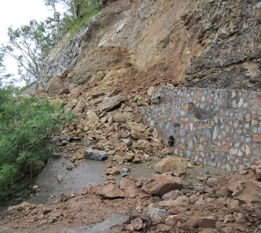 Pictured is rock slide on secondary road adjacent to Centerline Road near Reef Bay on St. John. Note the failed retaining wall. (Lynda Lohr photo)