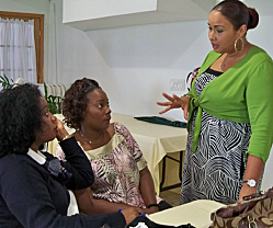 Antonia Harriette (from left) and Claire Malone of Budget Rental and Ingrid Rogue from Singh's Fast Food discuss customer service. 