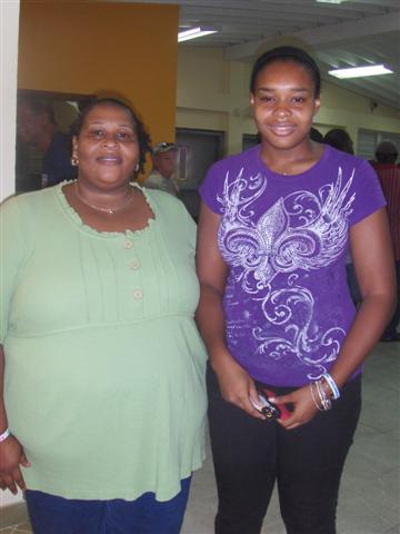 Dawn Simon (left) and 18-year-old Shiniqua Vanterpool posing before the teen's first vote.