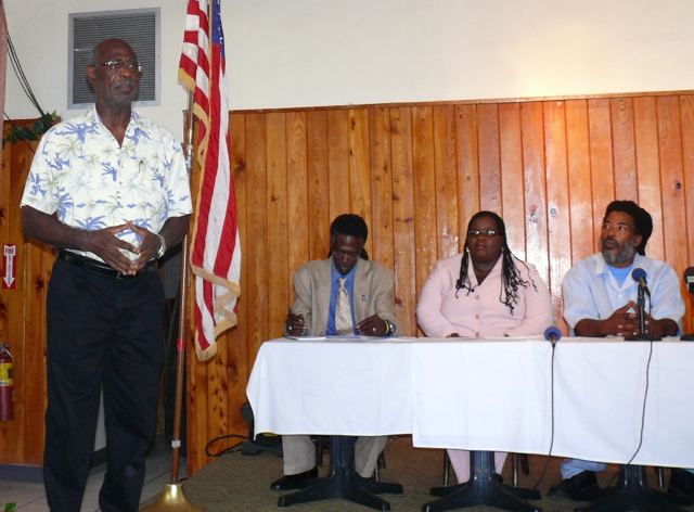 Former Sen. Virdin Brown talks about the party's history while candidates Terrence 'Positive' Nelson, Naomi Joseph and Kendall Petersen look on.