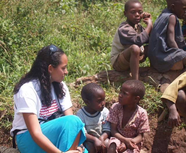 Diandra Capdeville sits with some of the children in Banda village.