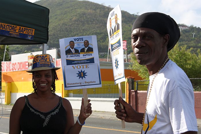 Keibo Thomas (right) helps at out the Donastorg/Baptiste tent.