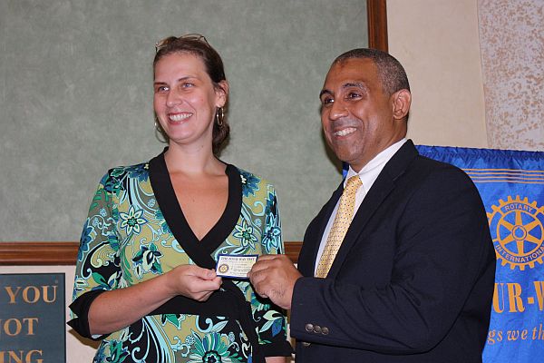 Rotary Sunrise President Kathrynn Green (left) teaches VITEMA head Mark Walters the Rotary way during Tuesday's meeting.