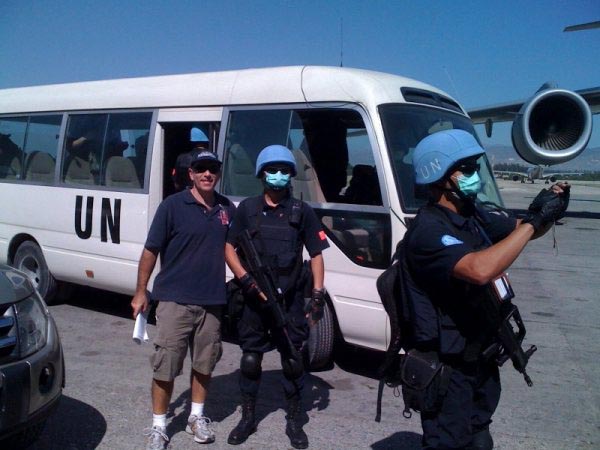 Shapiro (left) on the tarmac at Haiti's extremely busy airport.