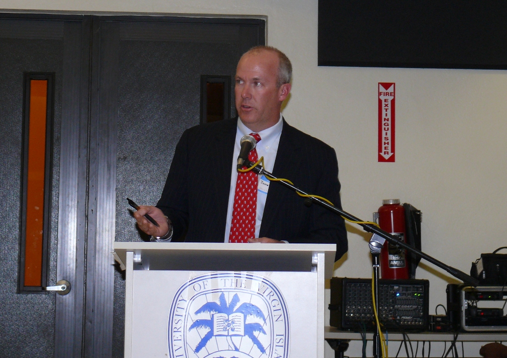 Alpine President James Beach responds to residents' concerns at Monday's town meeting.