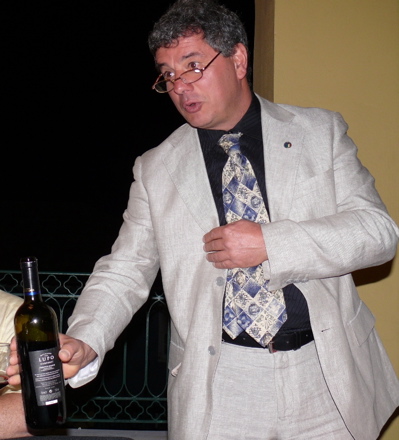 Loris Caprai, representative of Montescudaio, Italy, talks about his town’s wines and serves up several of them personally to a select audience at Friday's party on St. Croix.