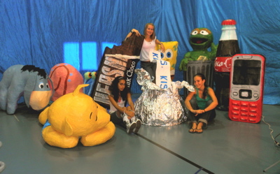 From left, Sabrini Mirpuri, Shannon Newland and Julia Hogroian pose among Antilles students' pop art objects.