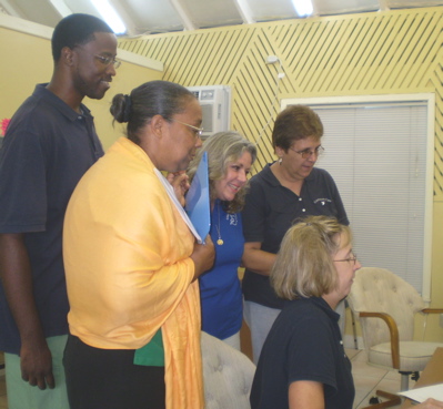Continuum Care staff members Collin Quailey, left, Luz Walters, Tracy Sanders, Carol Battuello, and Gayle Strid, seated.