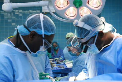 Dr. Moses deGraft-Johnson and his brother, Dr. John deGraft-Johnson, team up to perform the first open-heart surgery in the U.S. Virgin Islands.