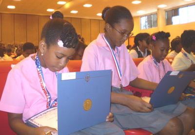 From left, Na'zirah Armstrong, Crystal Fahie and Destine James from Alfredo Andrews check out their certificates.