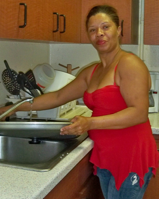 Altagrasia Lopez does dishes at Bethlehem House.