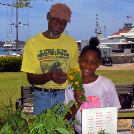 Brittany and Charlie man the booth at Yacht Haven Grande market.