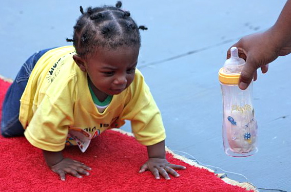 Galvanized by a bottle full of milk, Cameron Pascal was the first Toddler Derby winner of the day.