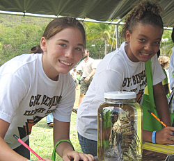 Maeven Parsil (left) and Mirisa Clendinen get into Earth Day activities.