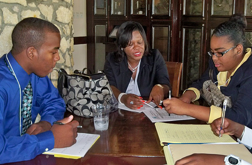 Collin Palmer (from left), Cheryl Jeremiah Ambrose and  Jazmine Wallace brainstorm Saturday.