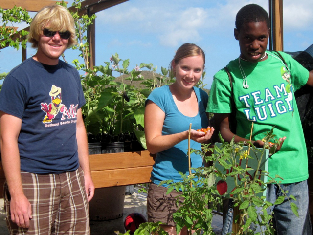 Mitch Meier and Laura Klavitter, both from Iowa State University, and Gifft Hill student K’yon Louis.