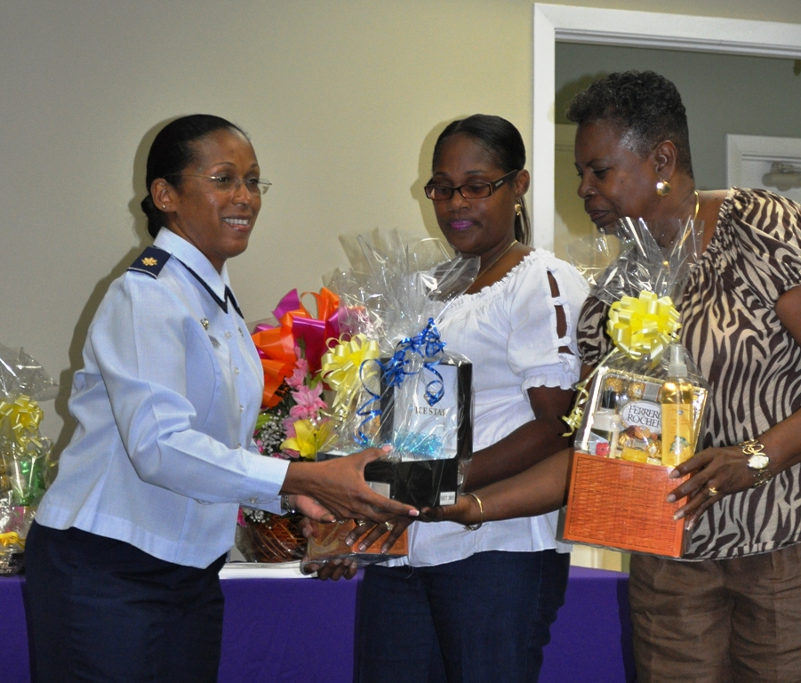 V.I. Air National Guard Squadron Commander, Maj. Glenda Mathurin-Lee, thanks volunteers Brenda Meyers and Geralda A. Miller with a token of appreciation.