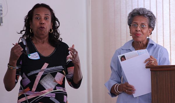 League President Gwen-Marie Moolenaar and past president Clovis Emanuel speak at this year's meeting.