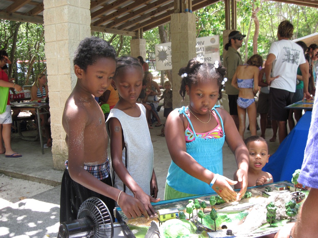 Local kids check out the V.I. Environmental Resource Station display.