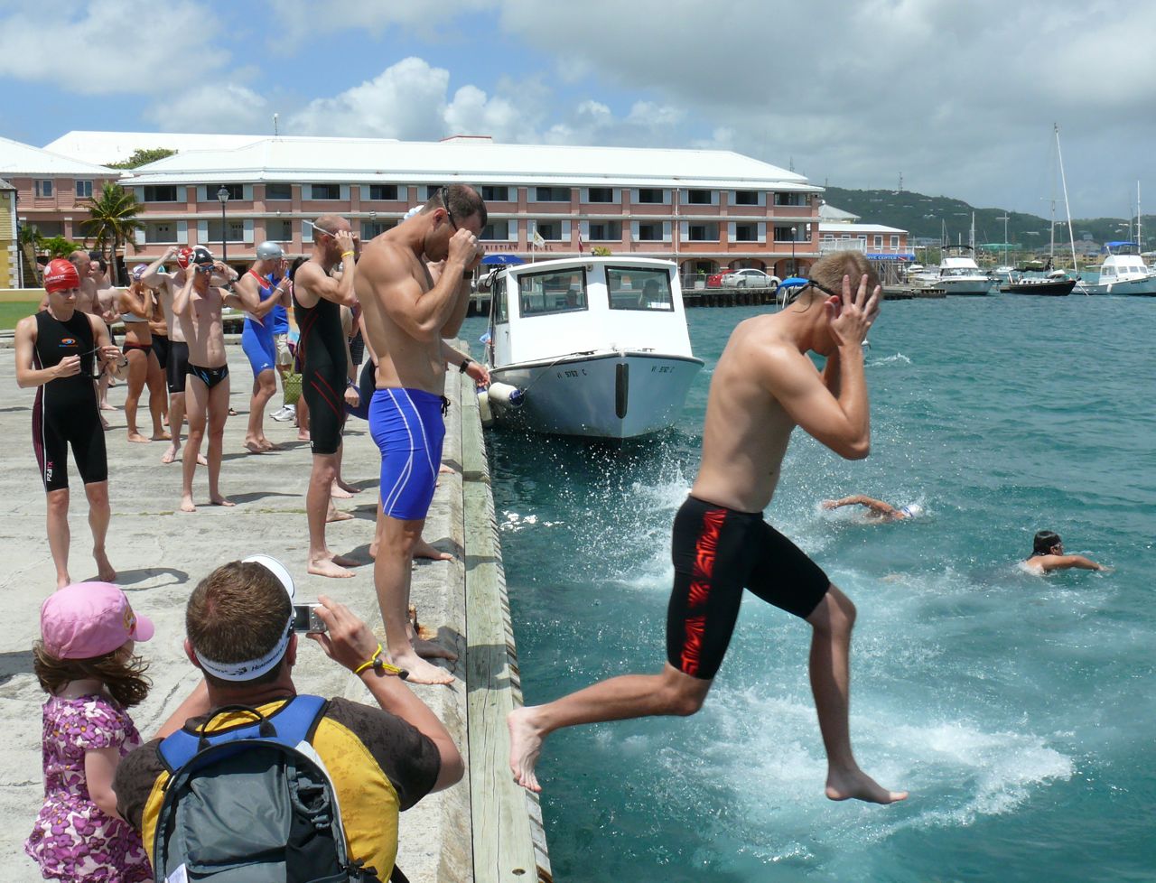 Triathletes jump into Christiansted Harbor Wednesday for a training swim before Sunday's St. Croix Half Ironman Triathlon