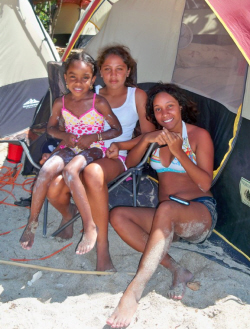 Aryana Weekes (from left), Angelitza Sanes and Jenny Liriano take a break in the shade.