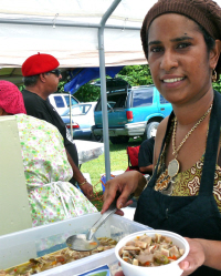 Norma Nales samples some homemade stewed pig's ear.