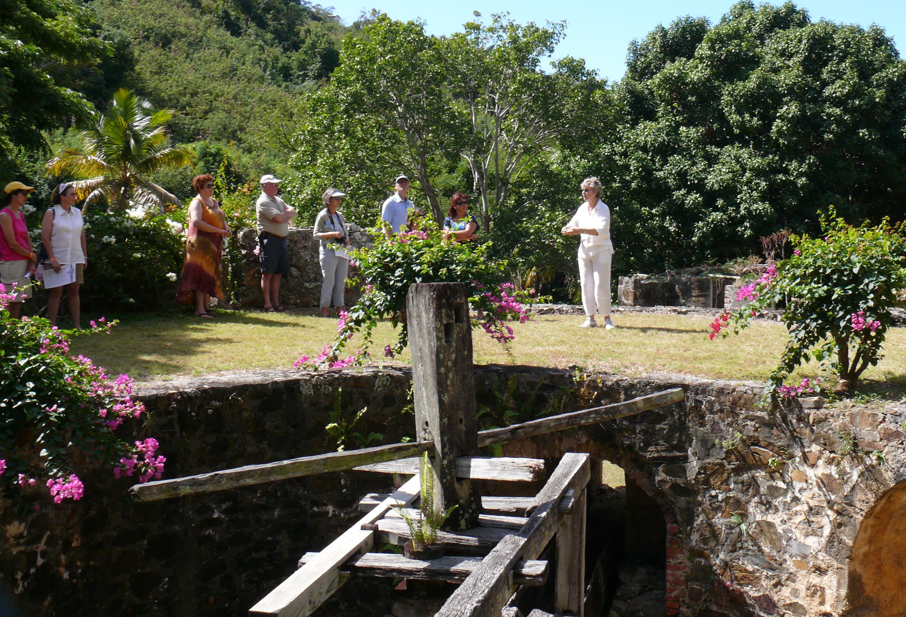 Nancy Ayer telling visitors about the old sugar manufacturing equipment on the grounds of the Ayer's property at Mt. Washington.