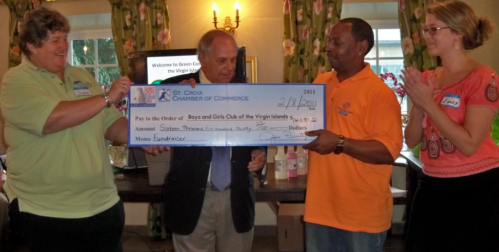 The Hotel and Tourism Association's Julie Printy (left) and Chamber Executive Director Michael Dembeck present a check to club officials Neil Canton and Emily Graci. 