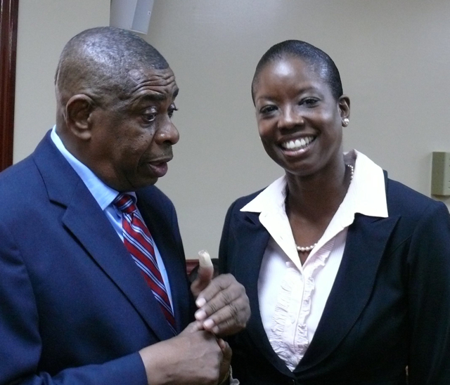 Sen. Celestino White congratulates Alicia Barnes after her confirmation hearing Thursday.