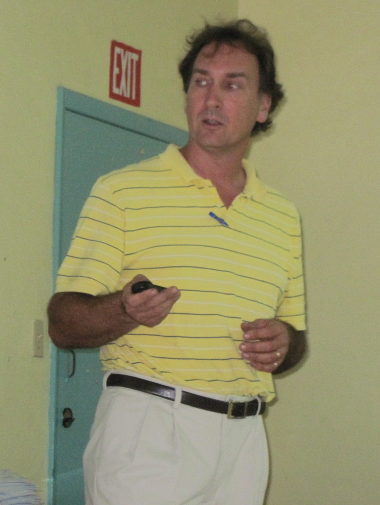 Coral Bay Community Council storm water engineer Chris Laude speaks Wednesday about the retention pond's design.