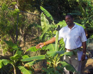 Vincent Henley proudly displays the Gladys Abraham Elementary School's garden.