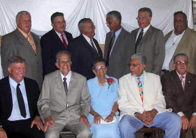The Richardson clan surrounds Josephine Richardson at her 95th birthday. Top row from left, Henry, Elmo, Allan, Leslie, Marius and Raymond. Bottom row from left, Gerald, Celeste, Josephine, Herman and Stephen.