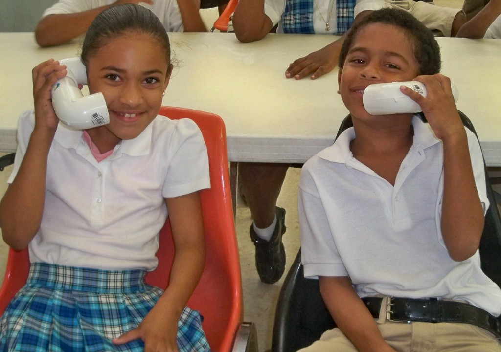 Sarai Ayala and Ezekiel Parrilla listen to themselves on Rotary Phonics Phones.