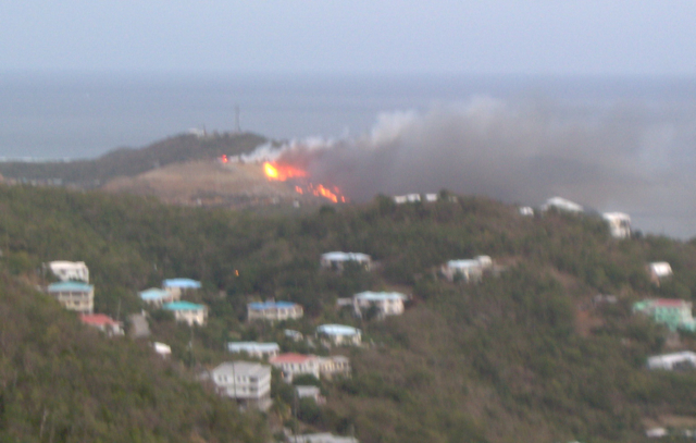 Fire races across Bovoni. (Photo by Richard Hanscom, Sr.)