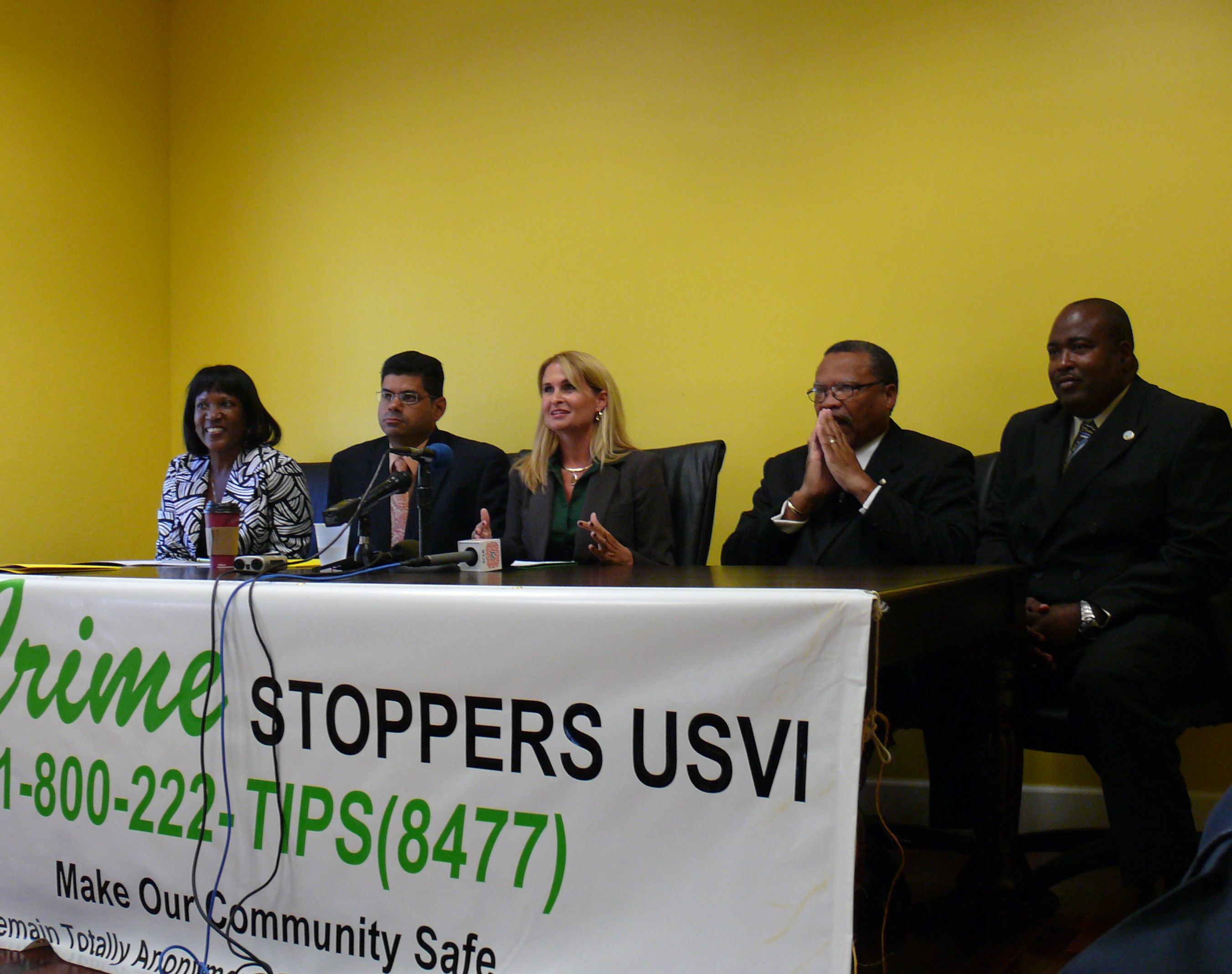 Crime Stoppers USVI's Judith Fricks (center) pointed to a long list of achievements during Tuesday's press conference.