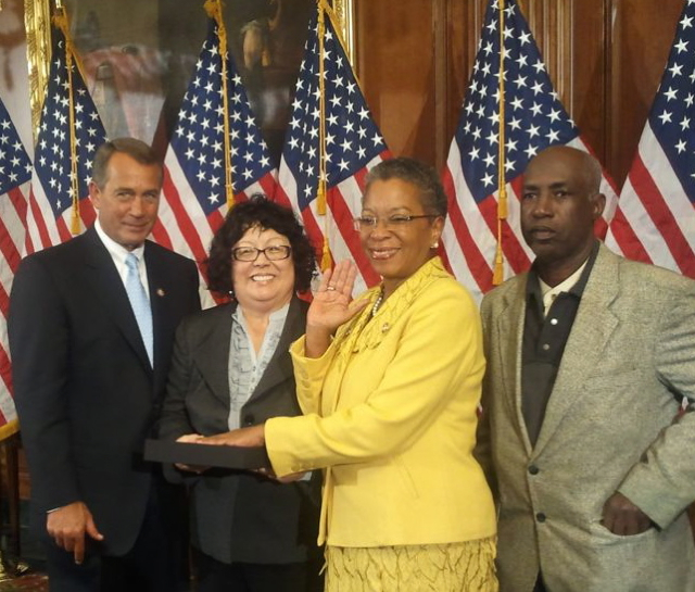 Delegate Donna Christensen is sworn in as a member of the 112th Congress Wednesday, flanked by House Speaker John Boehner, left, Christensen's close friend Naomi KaKor and St. John staffer Alvis Christian.