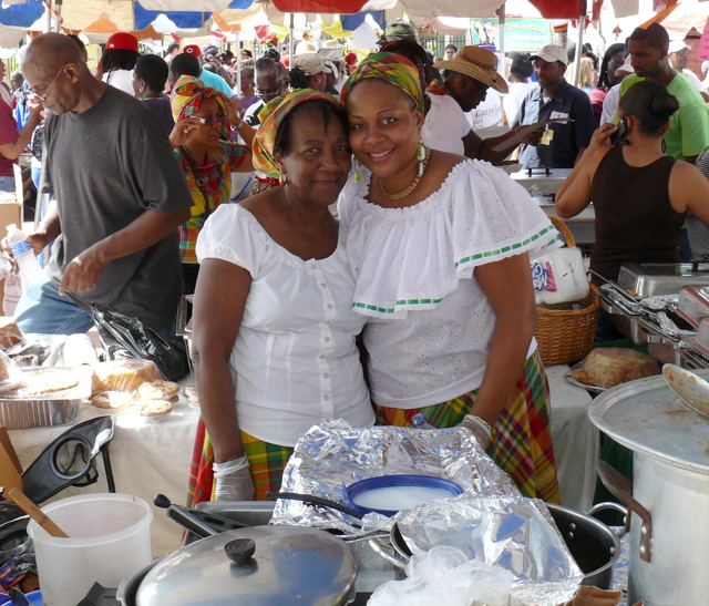 Elsa Clay and Dianna Arthurton of Frederiksted sell their wares to the throngs at the Food Arts and Crafts Fair Wednesday .