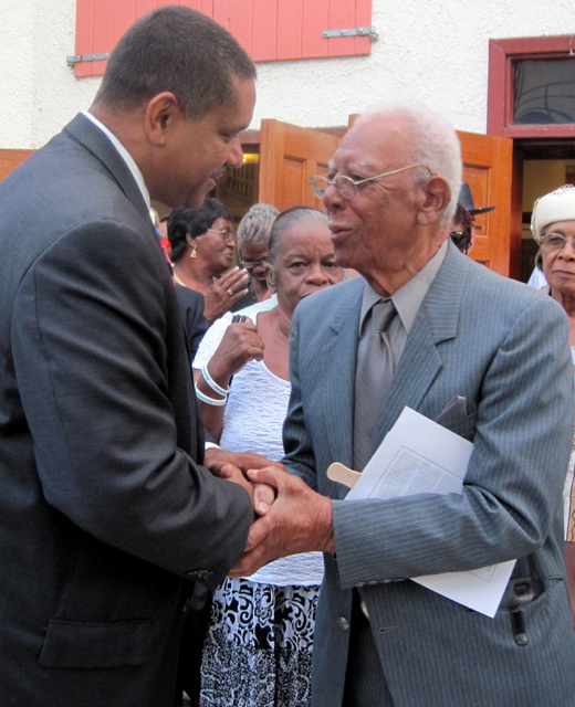 Gov. John deJongh Jr. greets St. John resident Calvin George.