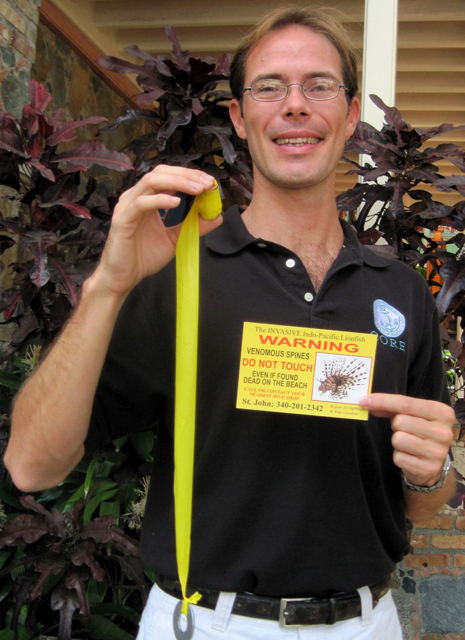 Karl Pytlik shows off one of the markers used to signal where the lionfish is found.