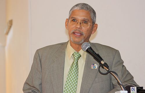 Sen. Ronald E. Russell heads the discussion at the League of Women Voters luncheon Monday.