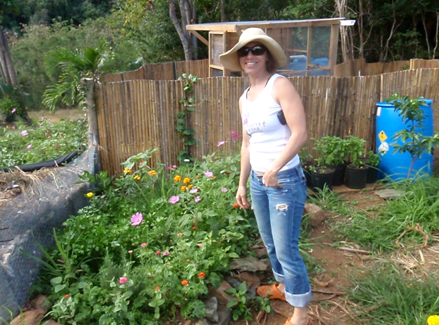 Shanna James stands amid her plant beds at Barefoot Farm.