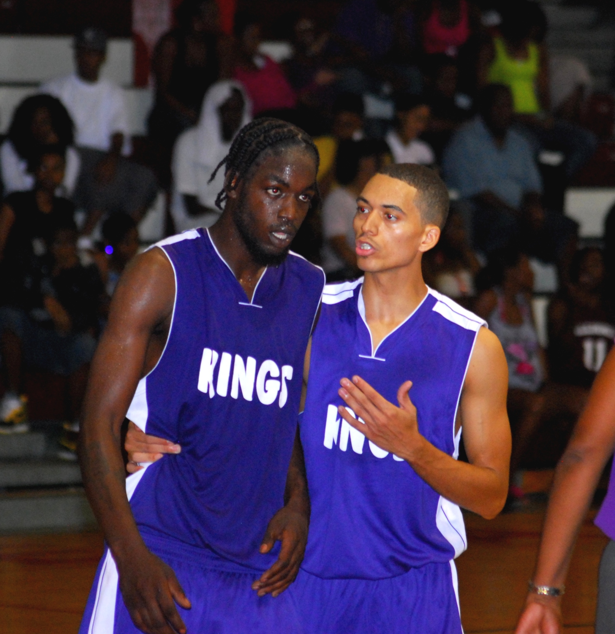 Kings guard Stephen O'Reilly calms DeVante Pryce after a hard foul in a physical fourth.